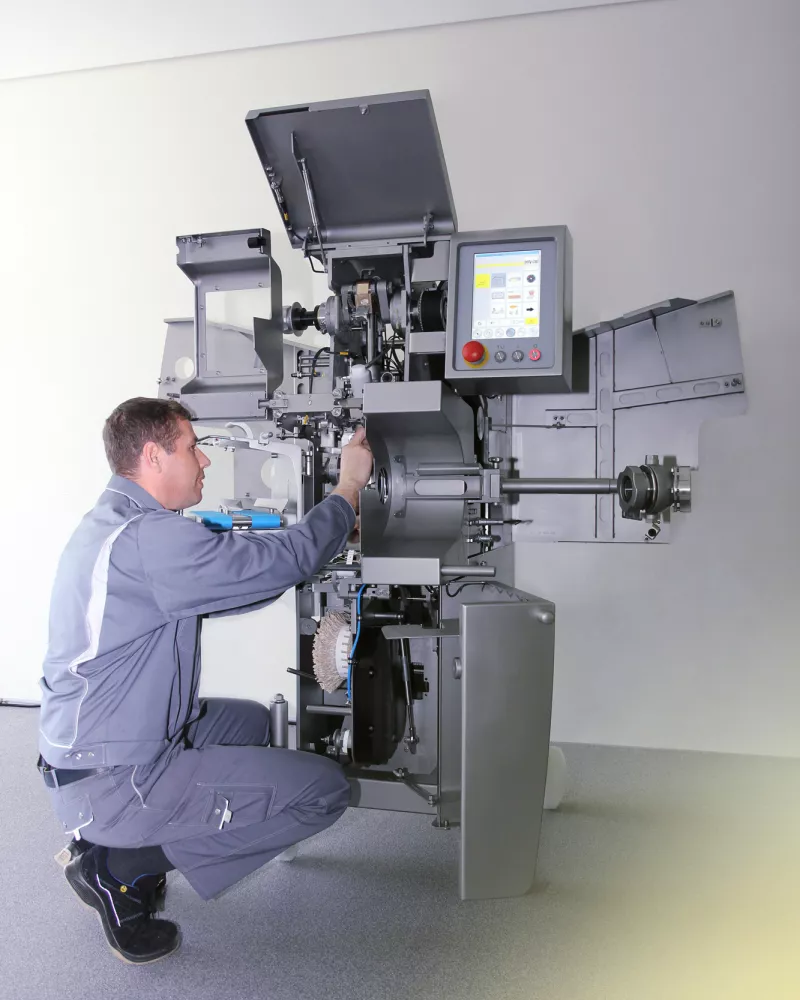 service employee working in clipping machine 