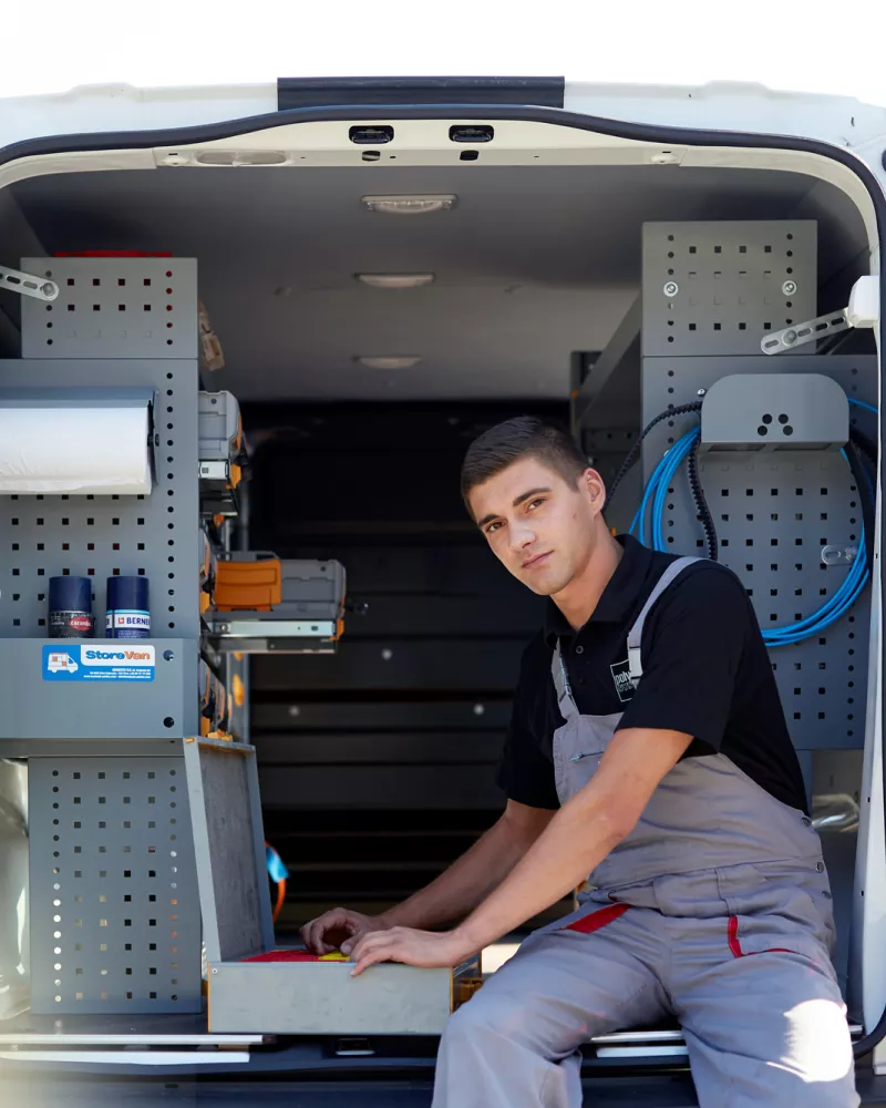 service employee sitting in the car